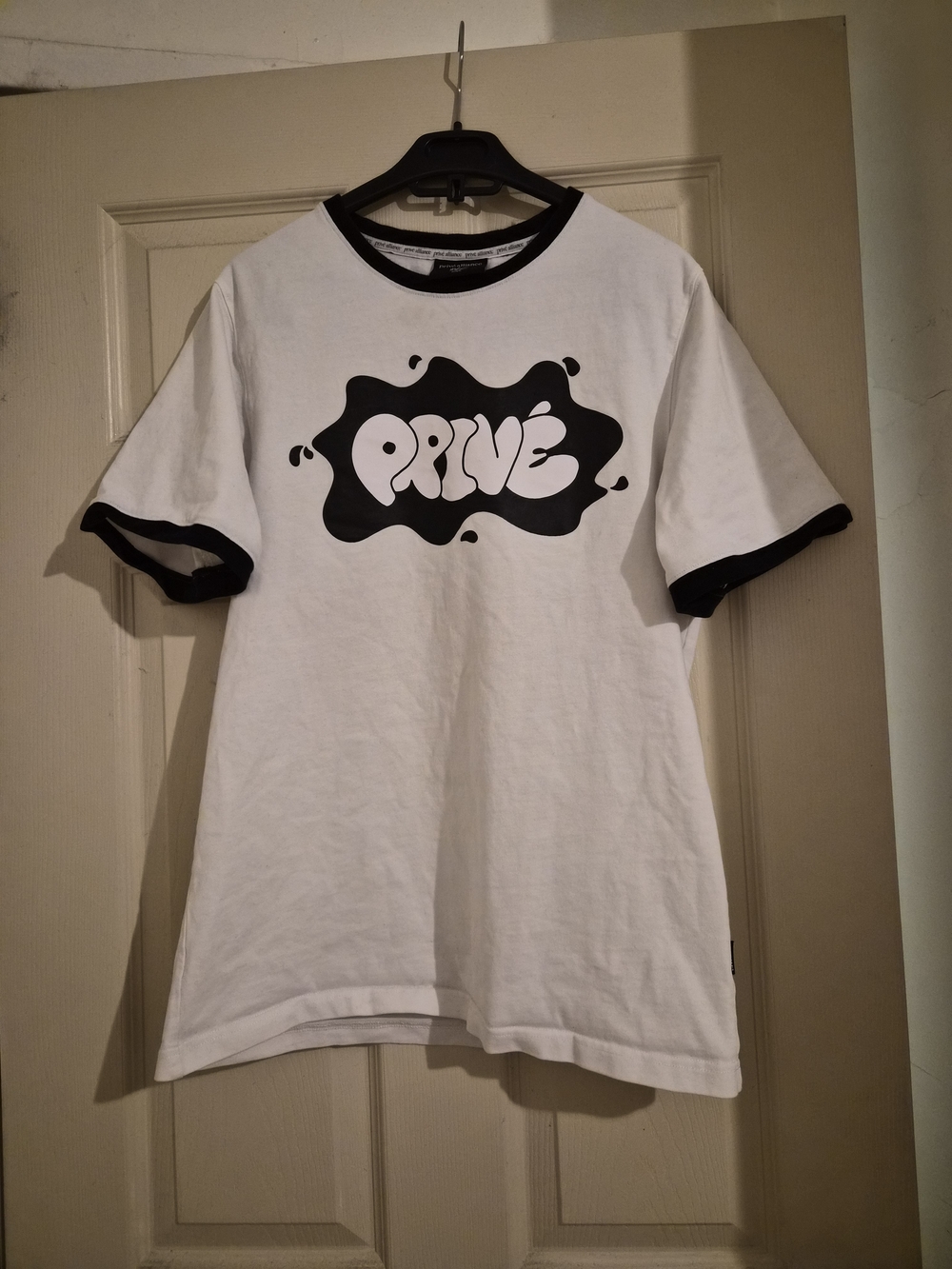 Privé Alliance White Tee with Black Brand Tab